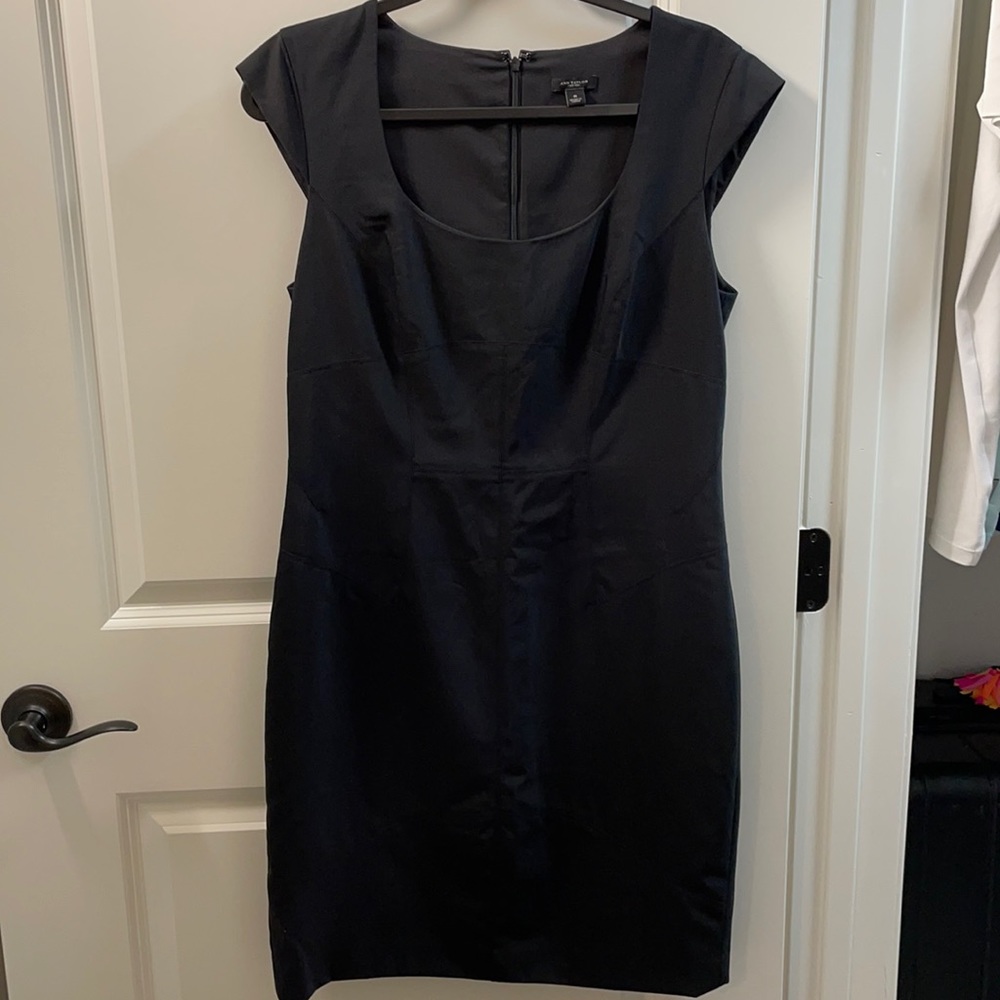 Never worn Black sheath dress with beautiful stitching and dainty capped sleeve